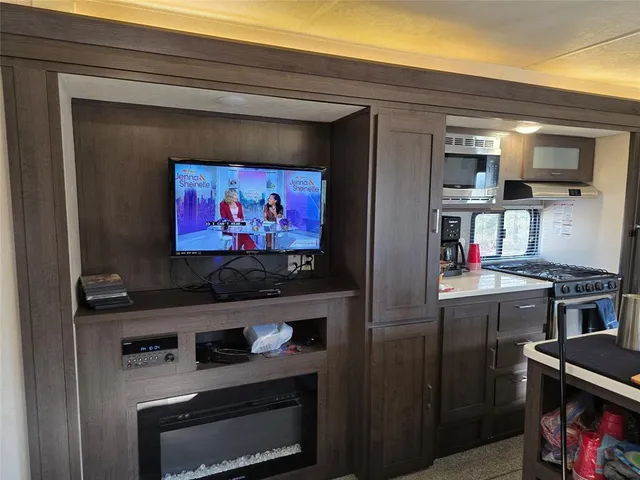 a kitchen with a stove and a microwave