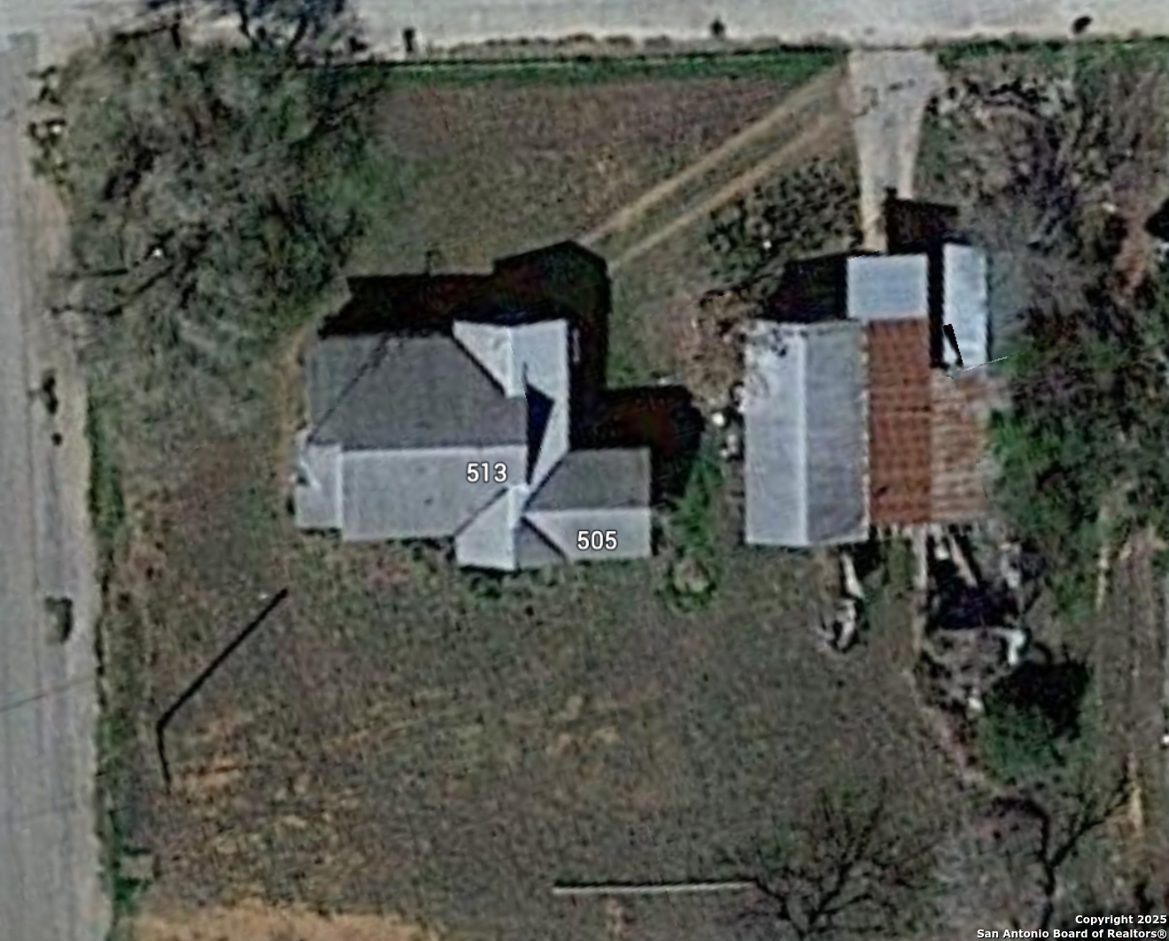505 East Rio Grande Street Pearsall, TX 78061 - Photo 4 of 12 an aerial view of a house with a yard