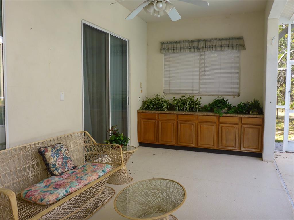 12271 Centralia Road Weeki Wachee, FL 34614 - Photo 17 of 36 a living room with furniture and a window