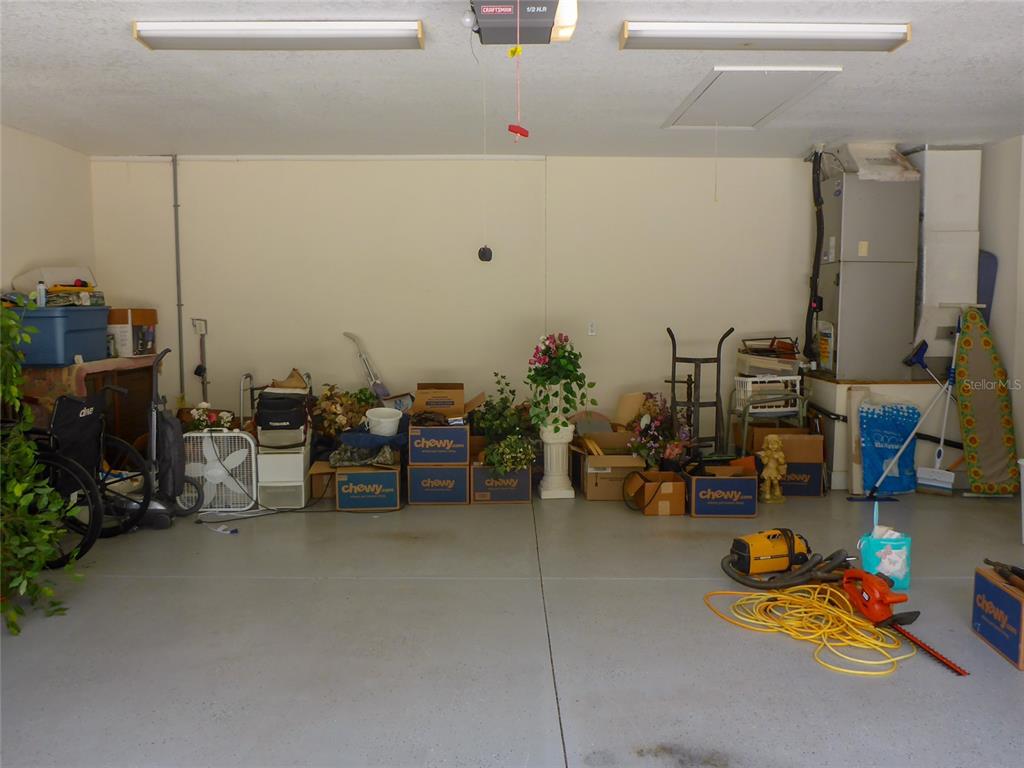 12271 Centralia Road Weeki Wachee, FL 34614 - Photo 20 of 36 a storage room with lots of clutter and buildings