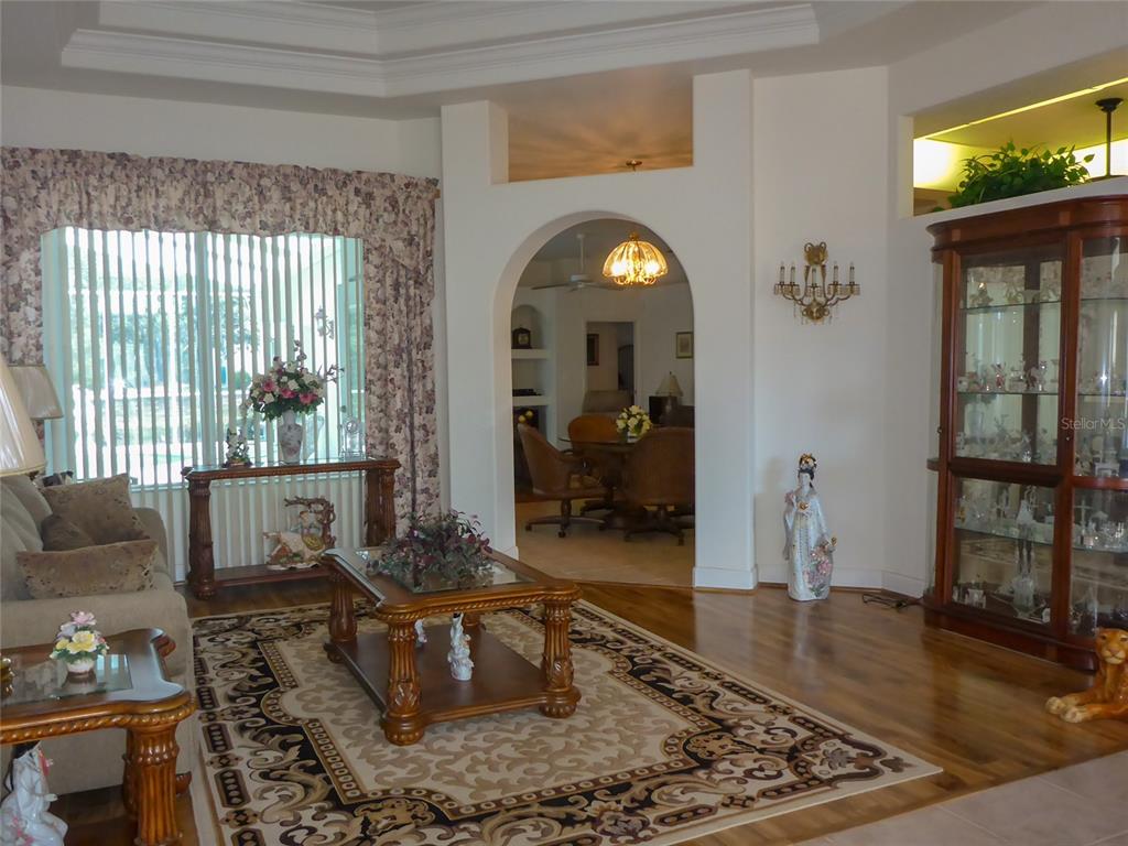 12271 Centralia Road Weeki Wachee, FL 34614 - Photo 2 of 36 a living room with furniture and a large window
