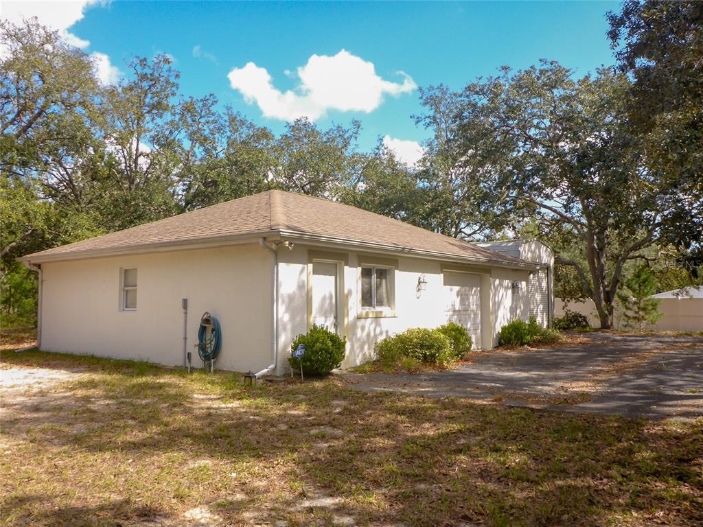 12271 Centralia Road Weeki Wachee, FL 34614 - Photo 27 of 36 a view of a house with a yard