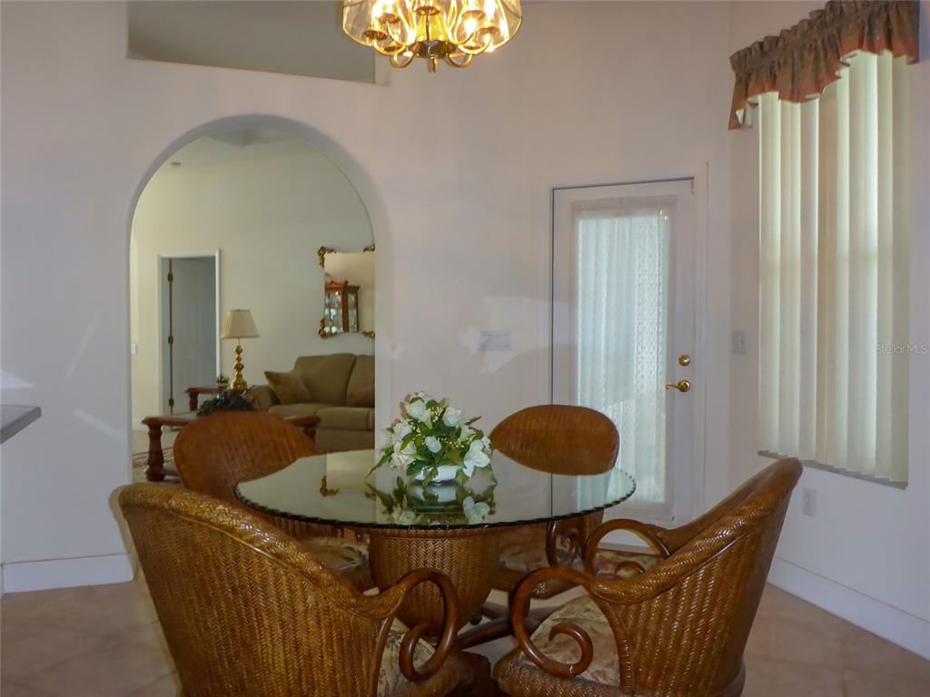 12271 Centralia Road Weeki Wachee, FL 34614 - Photo 6 of 36 a living room with furniture and a window