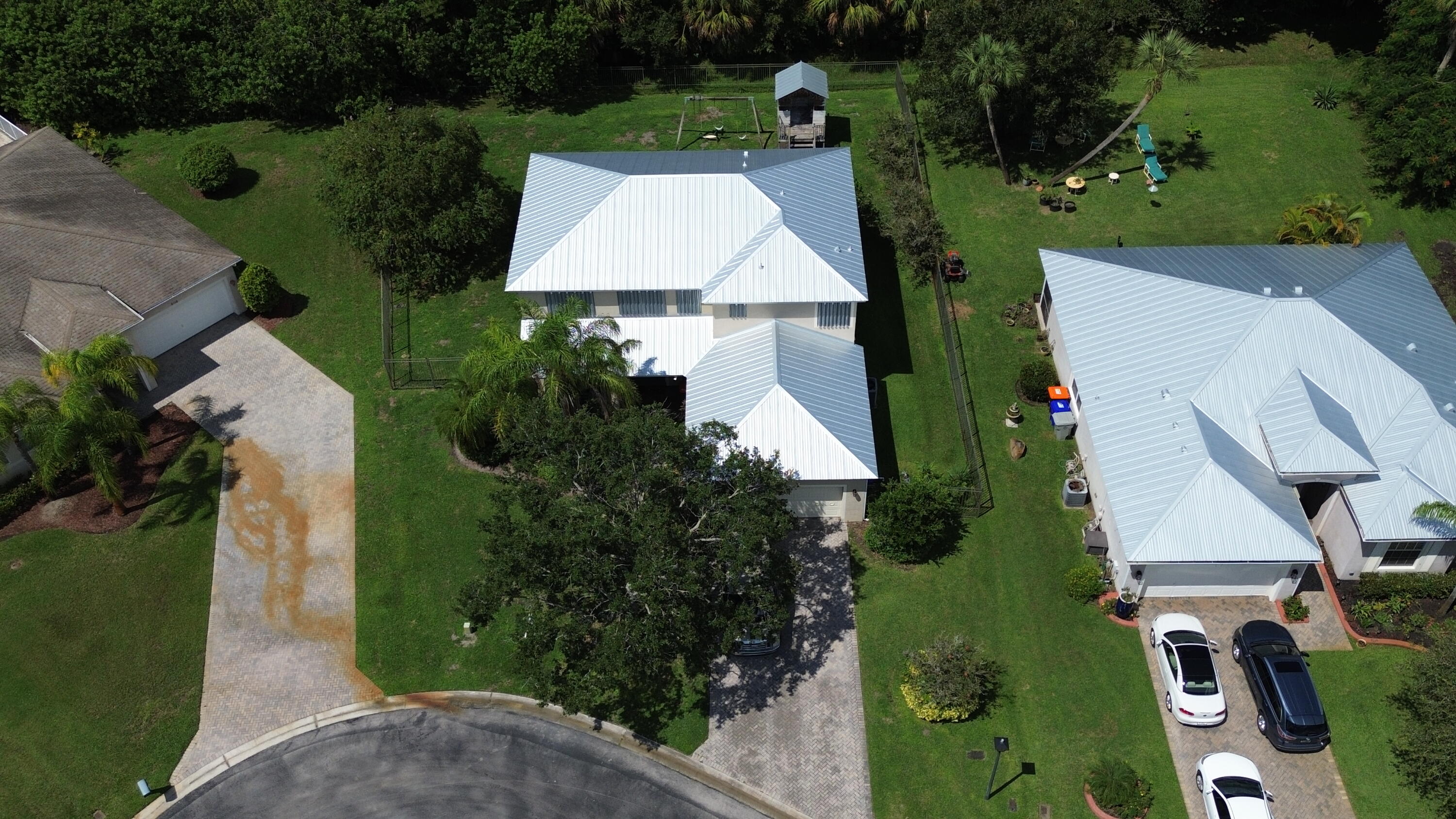 6090 46th Lane Vero Beach, FL 32967 - Photo 18 of 34 an aerial view of a house with a garden and trees
