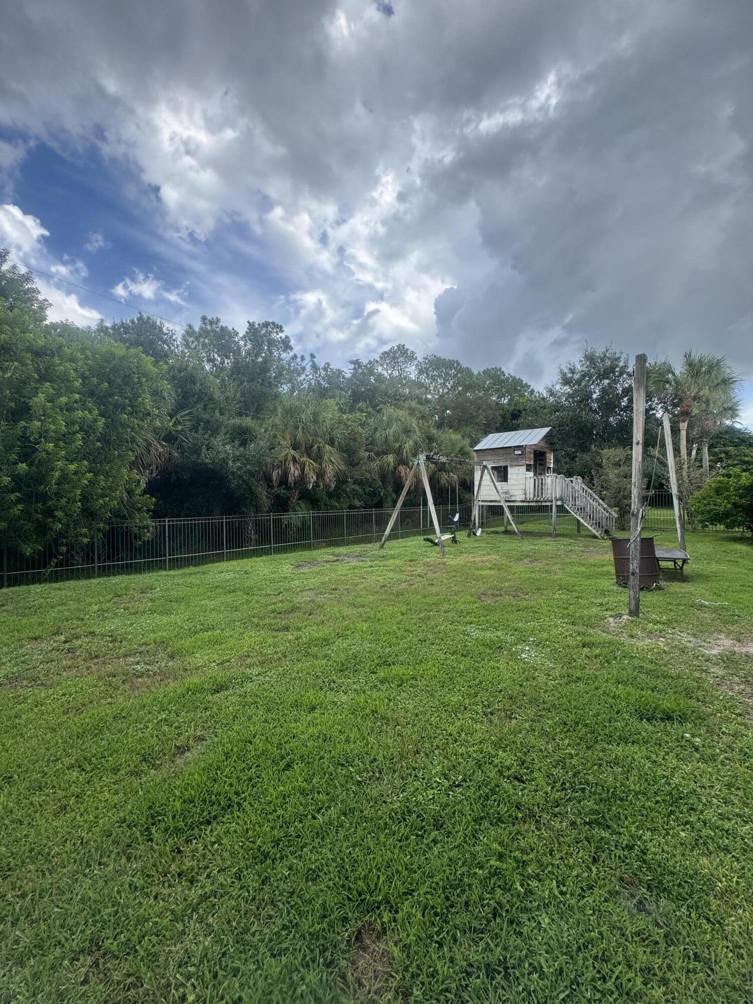 6090 46th Lane Vero Beach, FL 32967 - Photo 21 of 34 a view of a house with a backyard