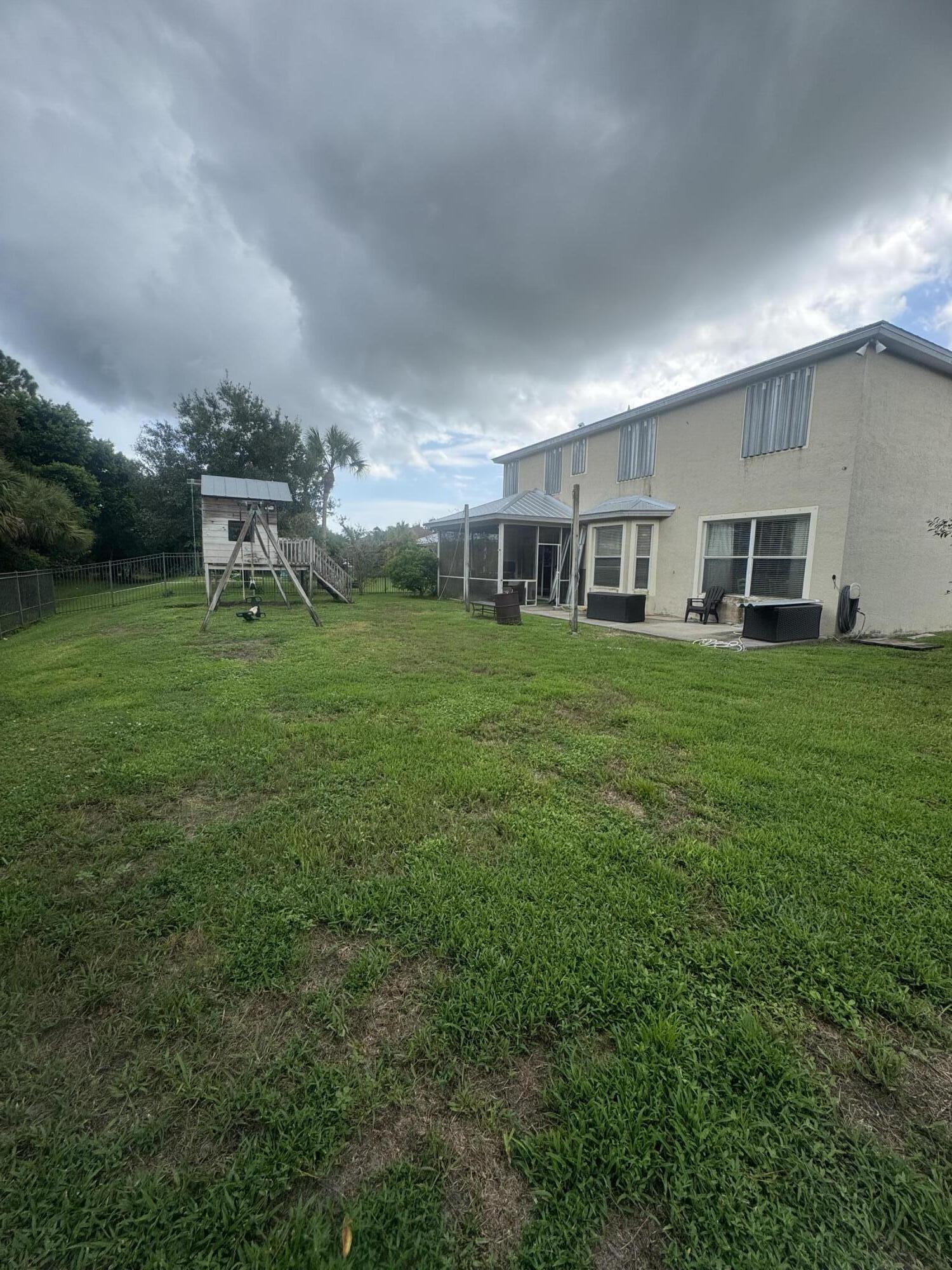 6090 46th Lane Vero Beach, FL 32967 - Photo 22 of 34 a house view with a garden space