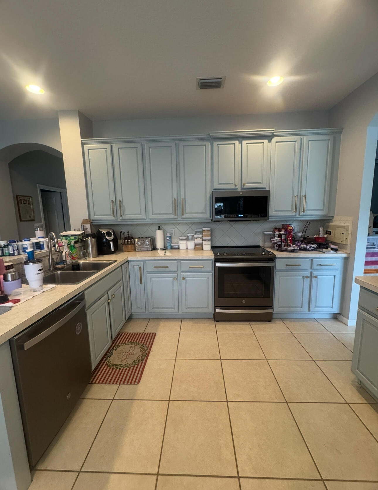 6090 46th Lane Vero Beach, FL 32967 - Photo 25 of 34 a kitchen with a cabinets a sink and a counter top space