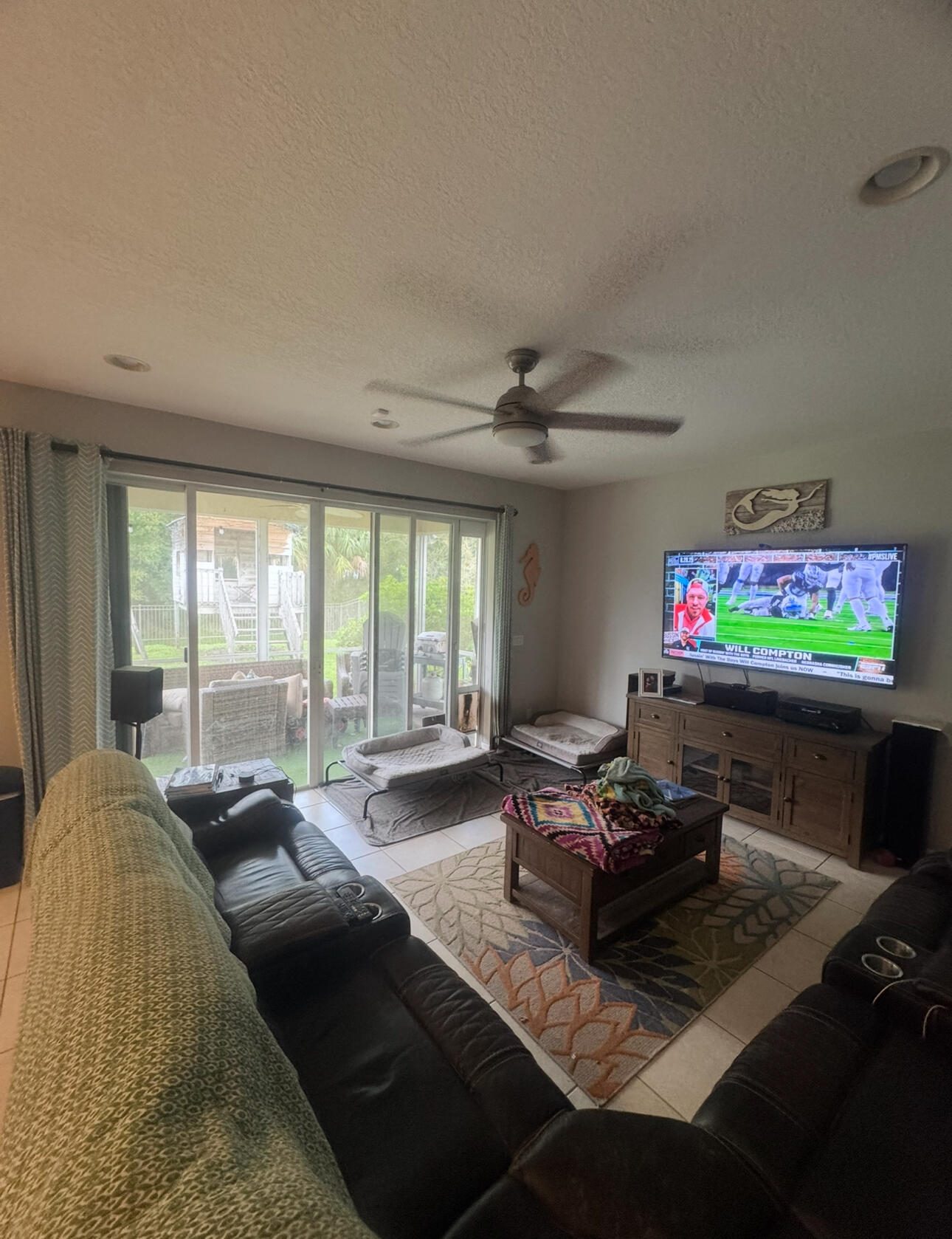 6090 46th Lane Vero Beach, FL 32967 - Photo 27 of 34 a living room with furniture and a flat screen tv