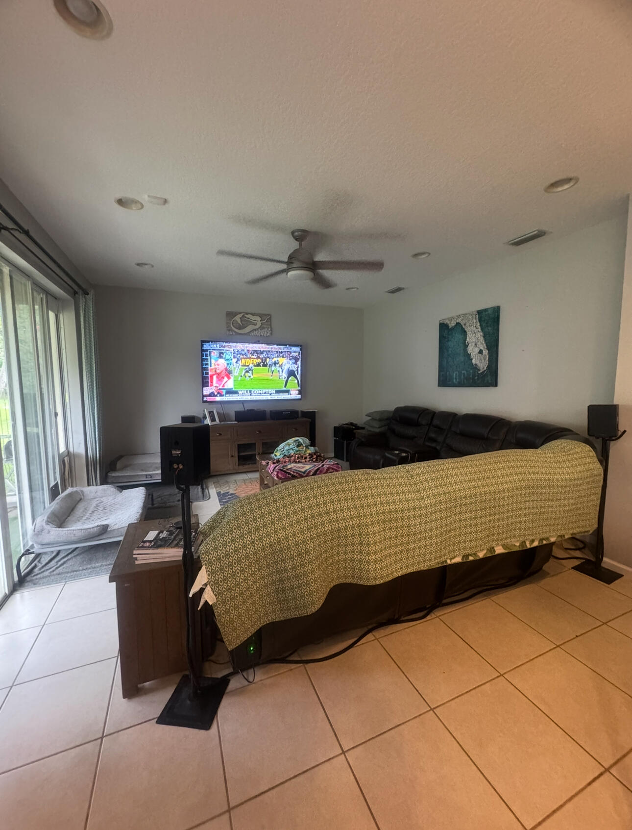 6090 46th Lane Vero Beach, FL 32967 - Photo 28 of 34 a bedroom with a bed and a flat screen tv