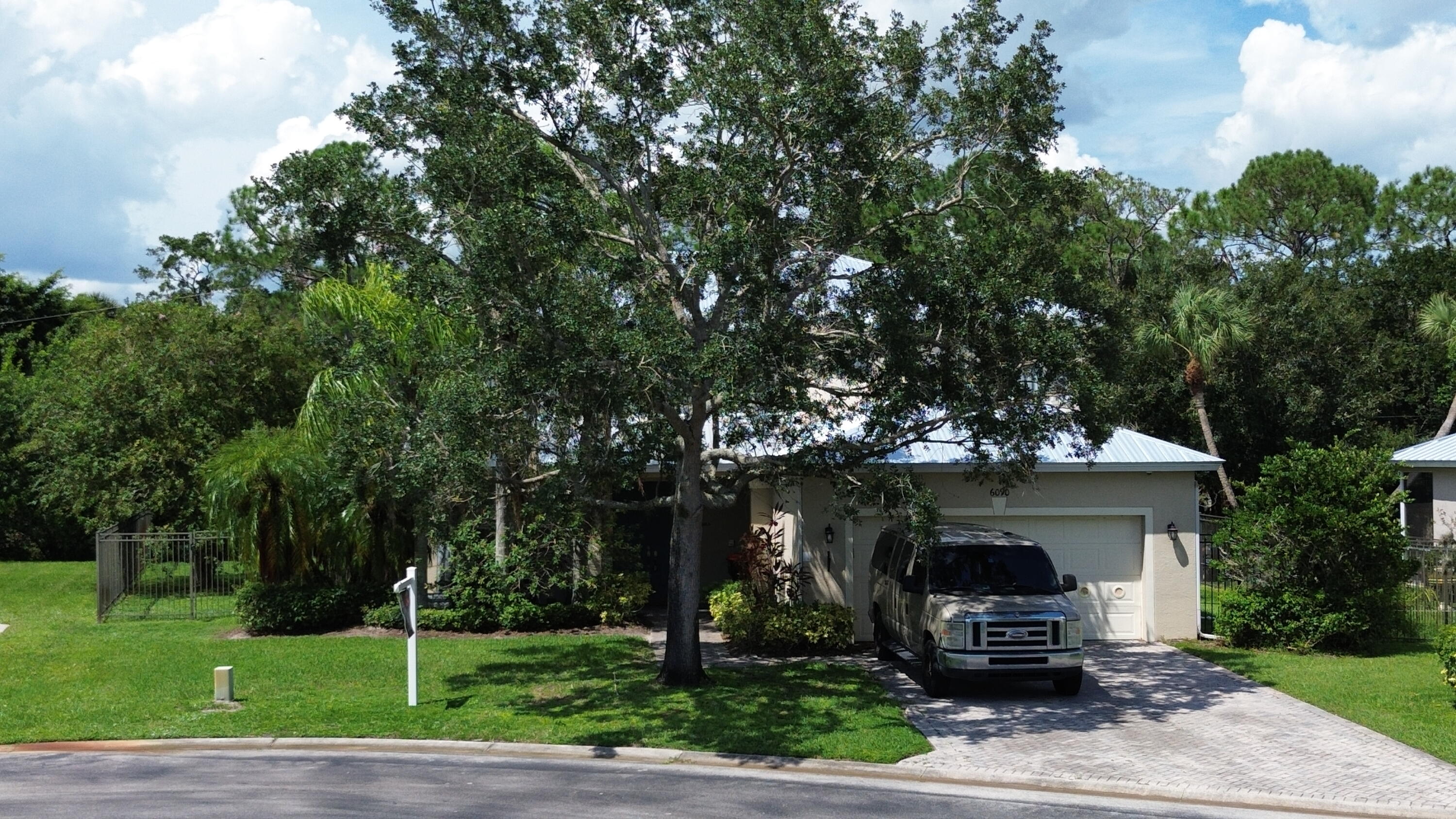 6090 46th Lane Vero Beach, FL 32967 - Photo 7 of 34 a front view of a house with garden