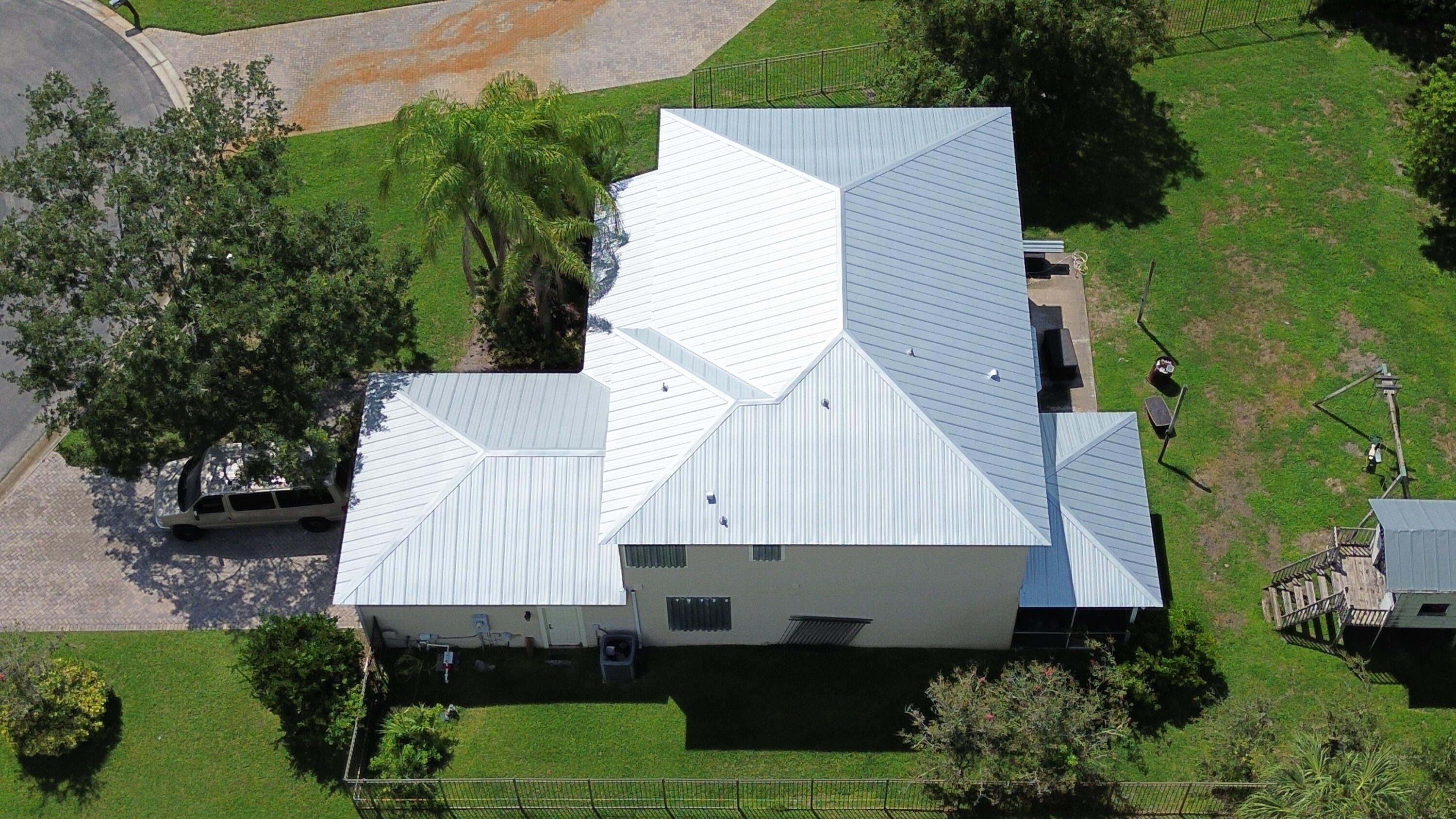 6090 46th Lane Vero Beach, FL 32967 - Photo 9 of 34 an aerial view of a house with a yard