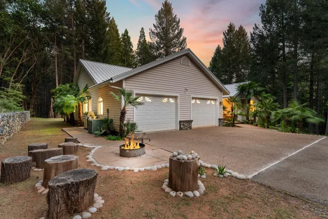 a view of a park with a bench and trees