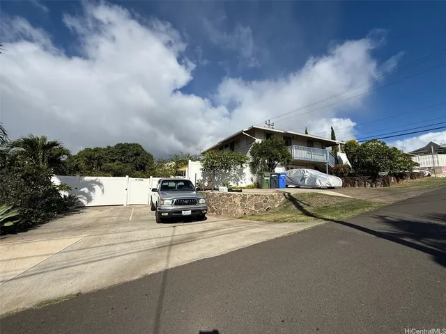 a view of street with parked cars