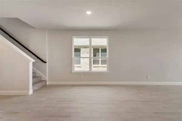 a view of kitchen with wooden floor and electronic appliances