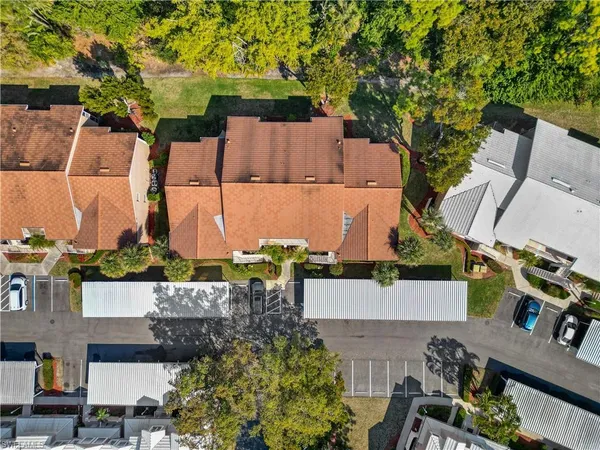 an aerial view of a residential houses with outdoor space