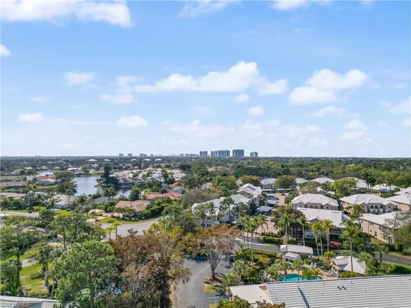an aerial view of a house with a swimming pool