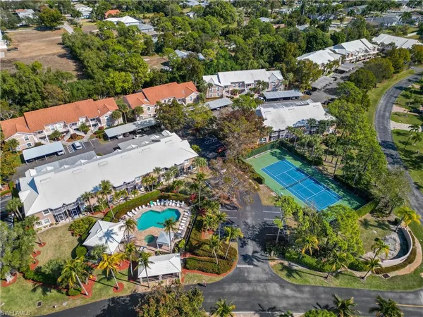 an aerial view of a house with yard swimming pool and outdoor seating