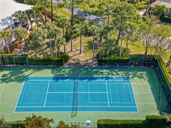 a view of a pathway of a house with a yard