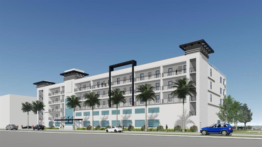 400 150th Avenue, Unit 307 Madeira Beach, FL 33708 - Photo 1 of 1 a front view of a building with a garden and plants
