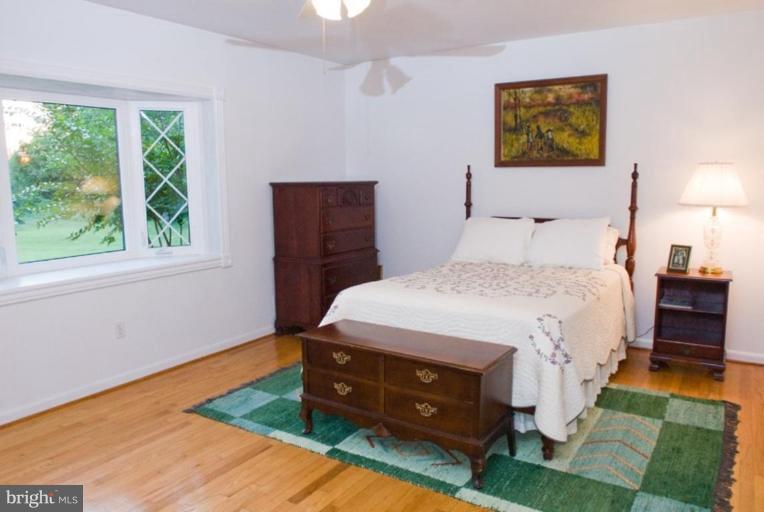 5618 Allender Road White Marsh, MD 21162 - Photo 14 of 19 a bedroom with a bed and a window