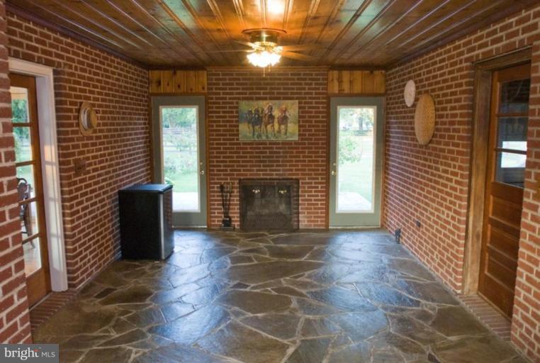 5618 Allender Road White Marsh, MD 21162 - Photo 5 of 19 a view of a porch with a door and a fireplace