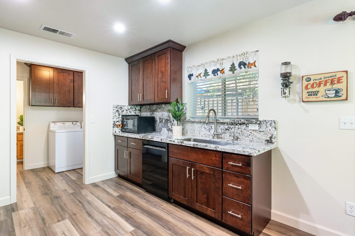 39398 Robin Bass Lake, CA 93604 - Photo 13 of 31 a kitchen with stainless steel appliances granite countertop a stove a sink and a microwave