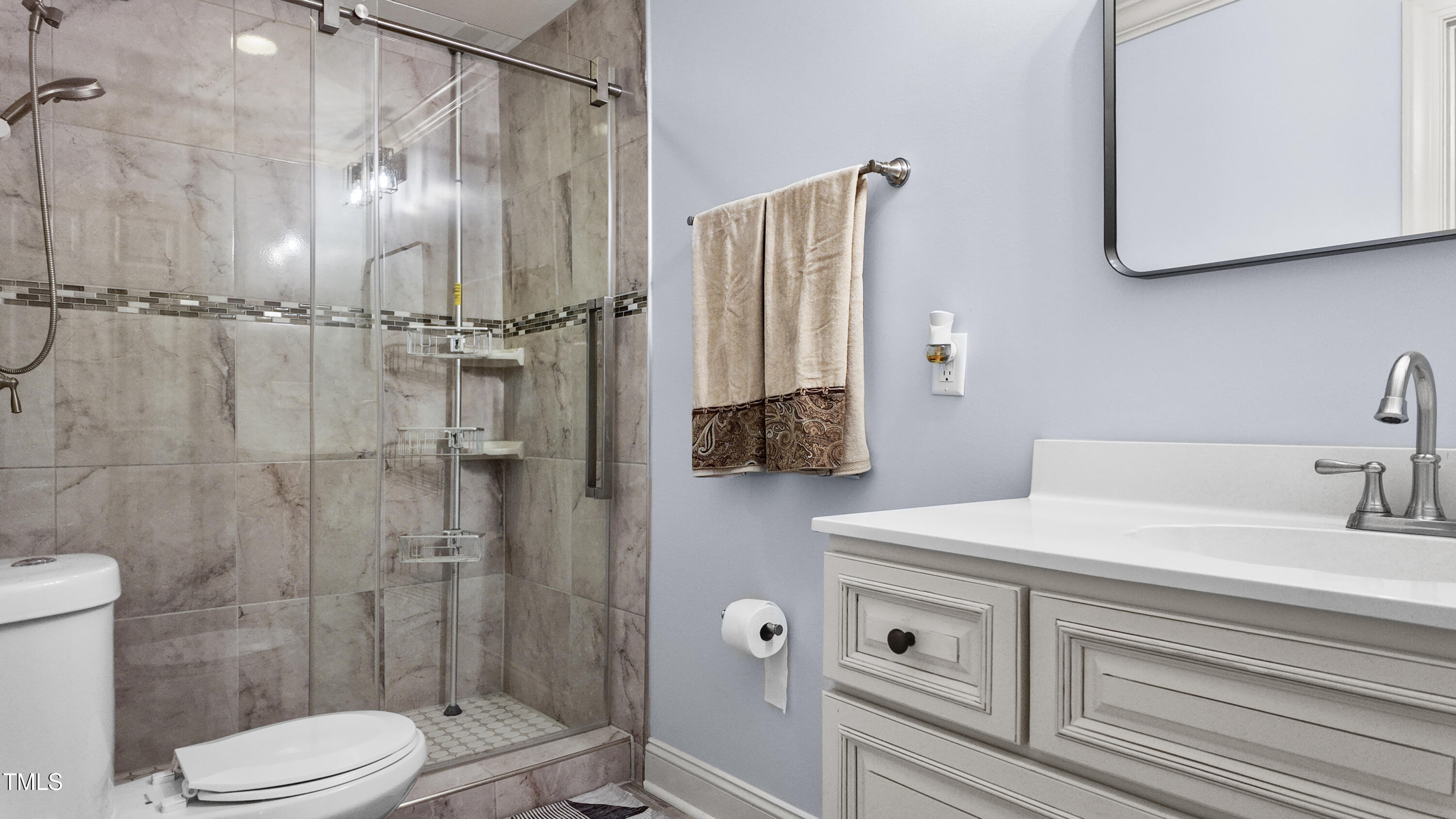 304 Spring Street Durham, NC 27703 - Photo 16 of 28 Updated bathrooms are a testament to modern elegance, boasting contemporary finishes and luxurious walk-in showers