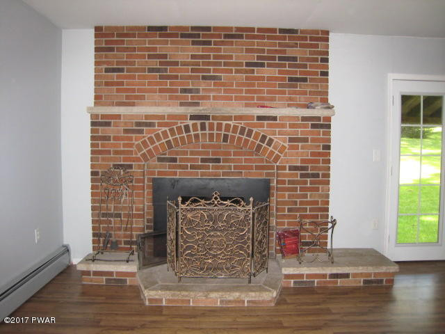1800 Ravnikar Road Waymart, PA 18472 - Photo 4 of 23 Fireplace with insert