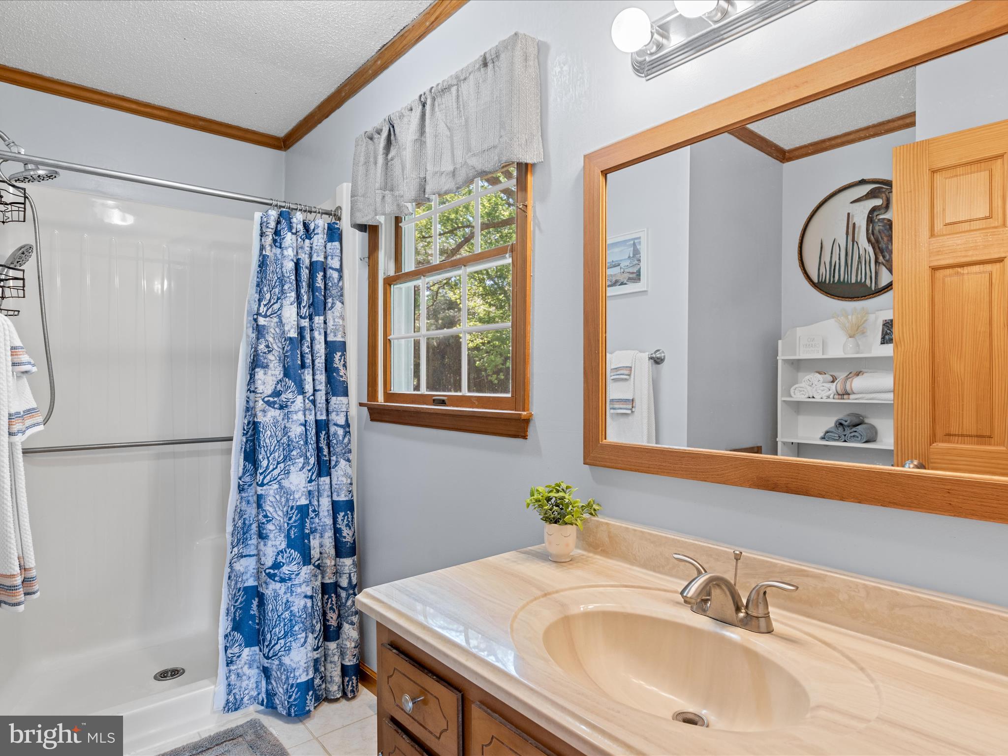 23488 Deal Island Road Deal Island, MD 21821 - Photo 19 of 52 a bathroom with a sink and a mirror