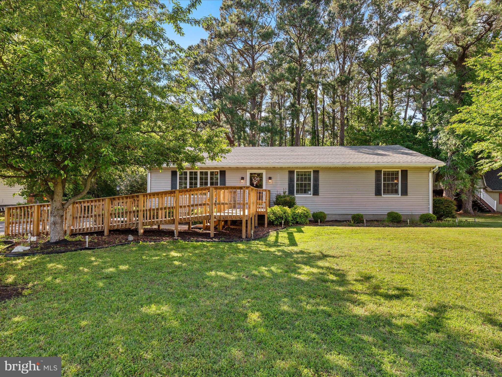 23488 Deal Island Road Deal Island, MD 21821 - Photo 42 of 52 a view of a house with a yard and sitting area