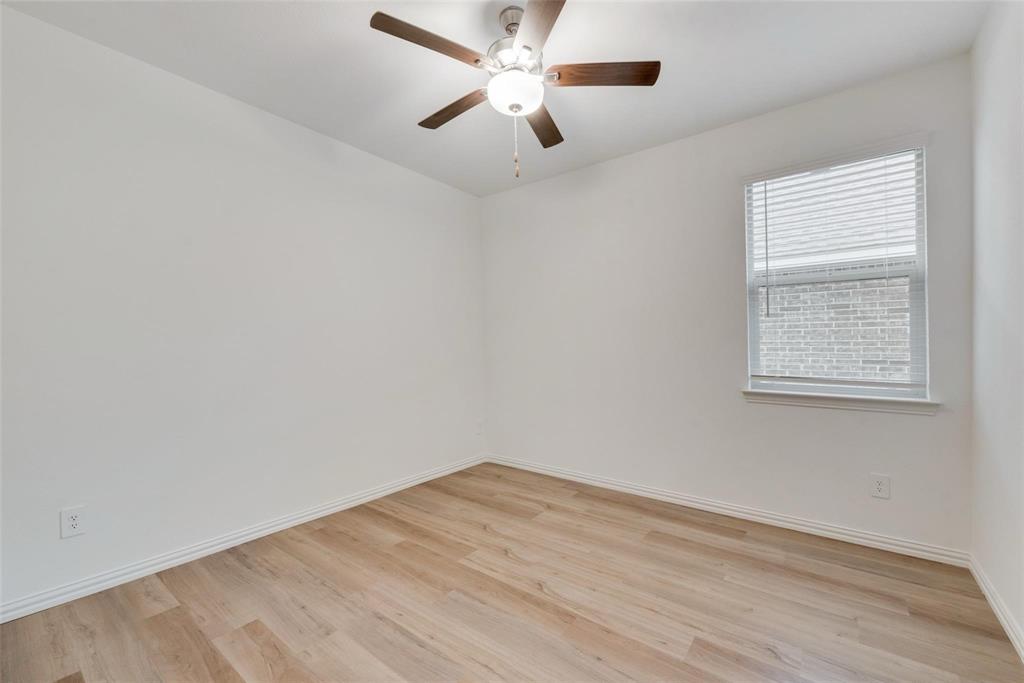 1108 Rumble Drive Fate, TX 75087 - Photo 11 of 12 an empty room with a window and a fan