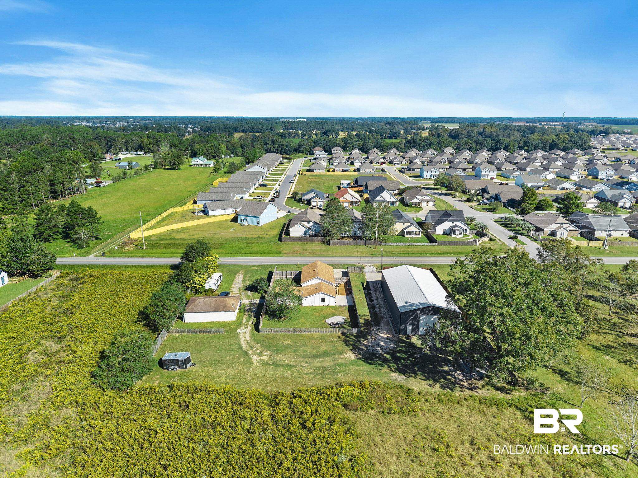 16796 Thompson Road Loxley, AL 36551 - Photo 85 of 93 Aerial view of property and surrounding area with nearby suburban area
