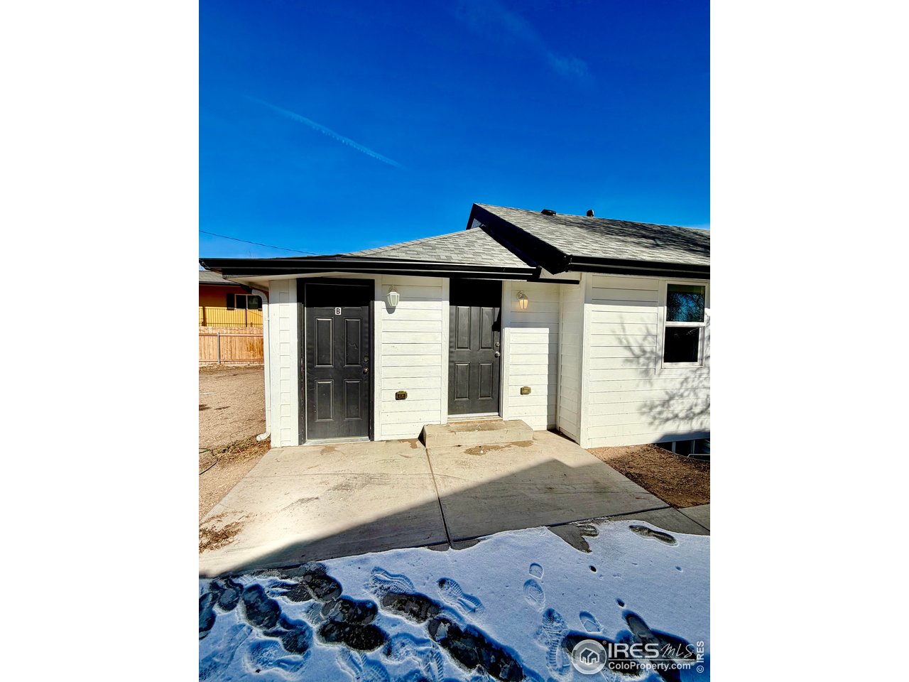2015 5th Avenue, Unit A AND B Greeley, CO 80631 - Photo 12 of 15 a bedroom with a bed and a window