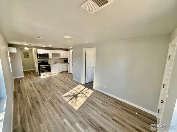 a view of living room with furniture and flat screen tv