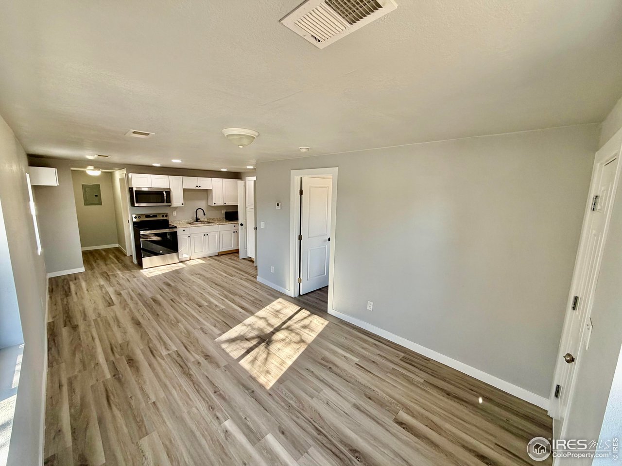 2015 5th Avenue, Unit A AND B Greeley, CO 80631 - Photo 3 of 15 a view of living room with furniture and flat screen tv