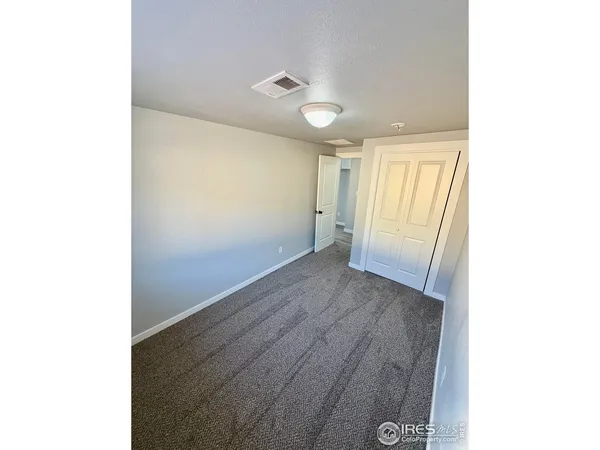 a view of hallway with wooden floor