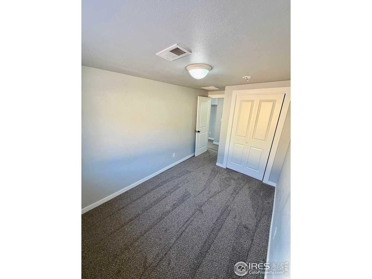 2015 5th Avenue, Unit A AND B Greeley, CO 80631 - Photo 6 of 15 a view of hallway with wooden floor