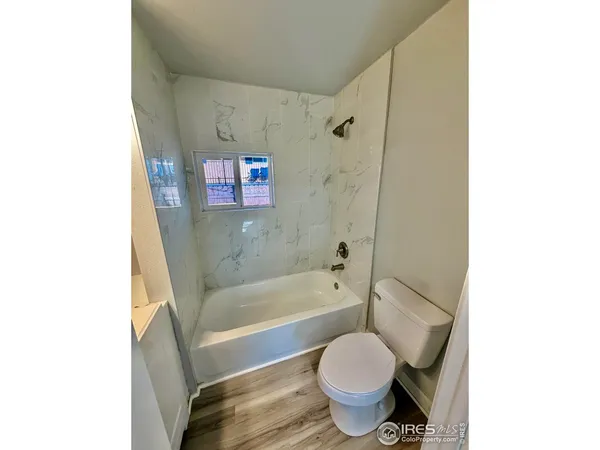 a bathroom with a sink toilet and bathtub