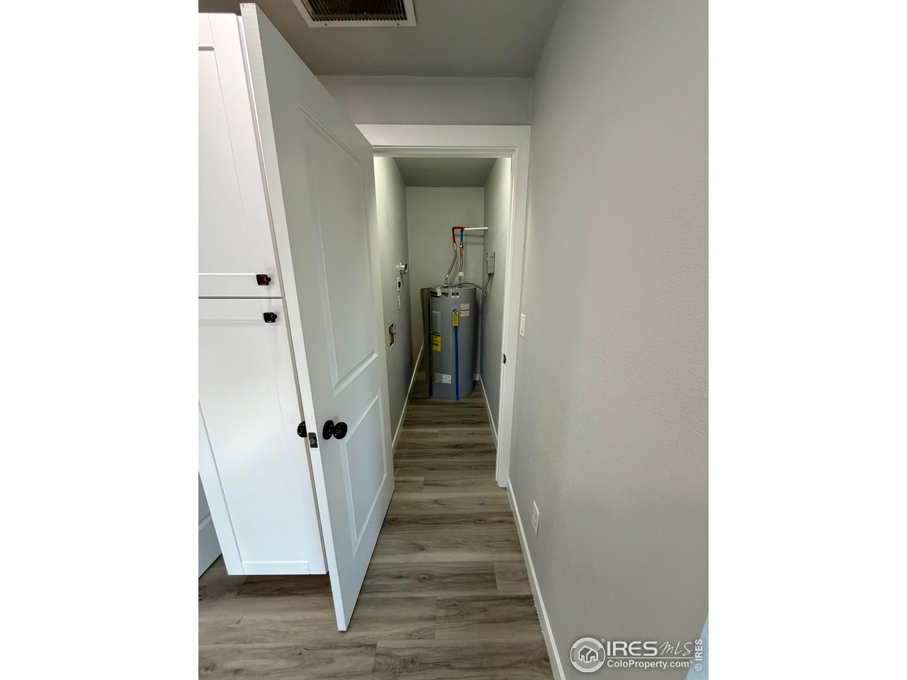 2015 5th Avenue, Unit A AND B Greeley, CO 80631 - Photo 9 of 15 a view of a hallway with wooden floor and stairs