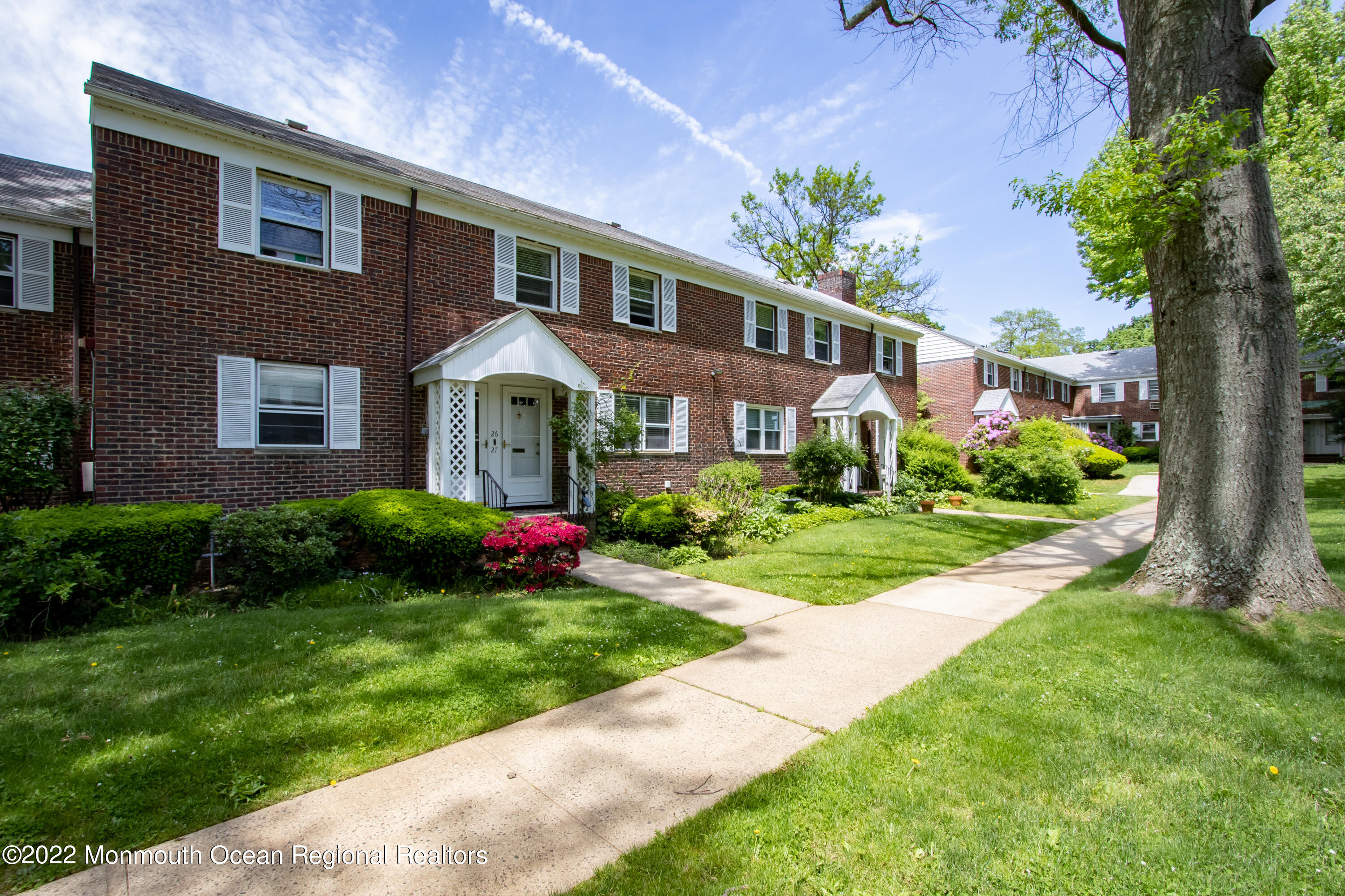 27 Manor Drive Red Bank, NJ 07701 - Photo 1 of 17 a front view of house with yard and green space