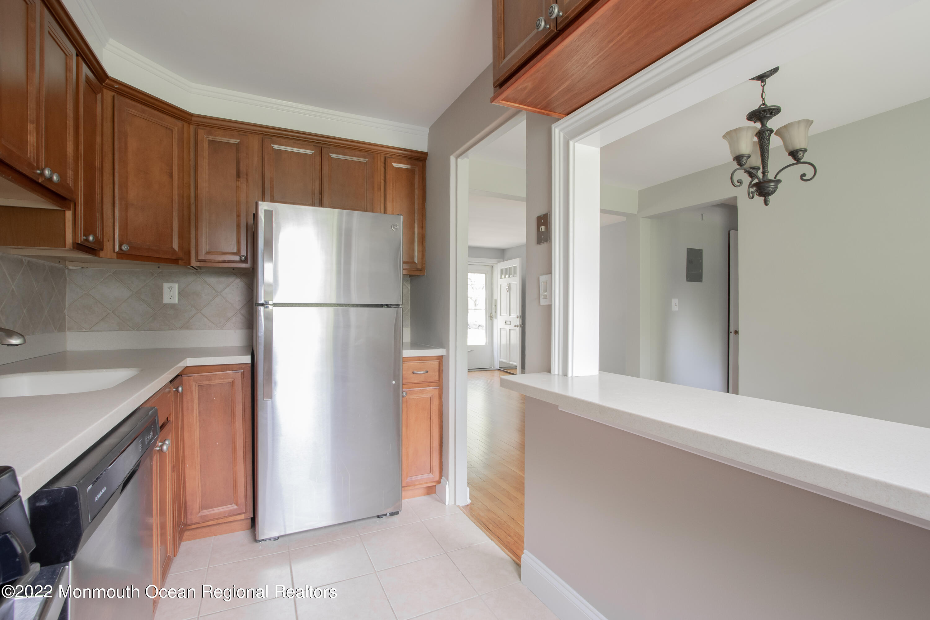 27 Manor Drive Red Bank, NJ 07701 - Photo 11 of 17 a kitchen with stainless steel appliances granite countertop a refrigerator and a sink