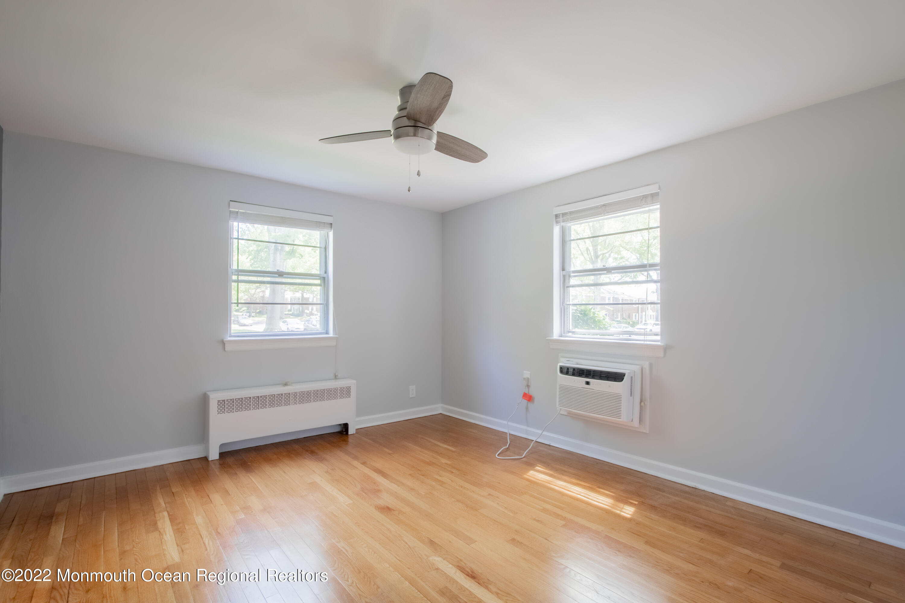 27 Manor Drive Red Bank, NJ 07701 - Photo 14 of 17 wooden floor in an empty room with a window
