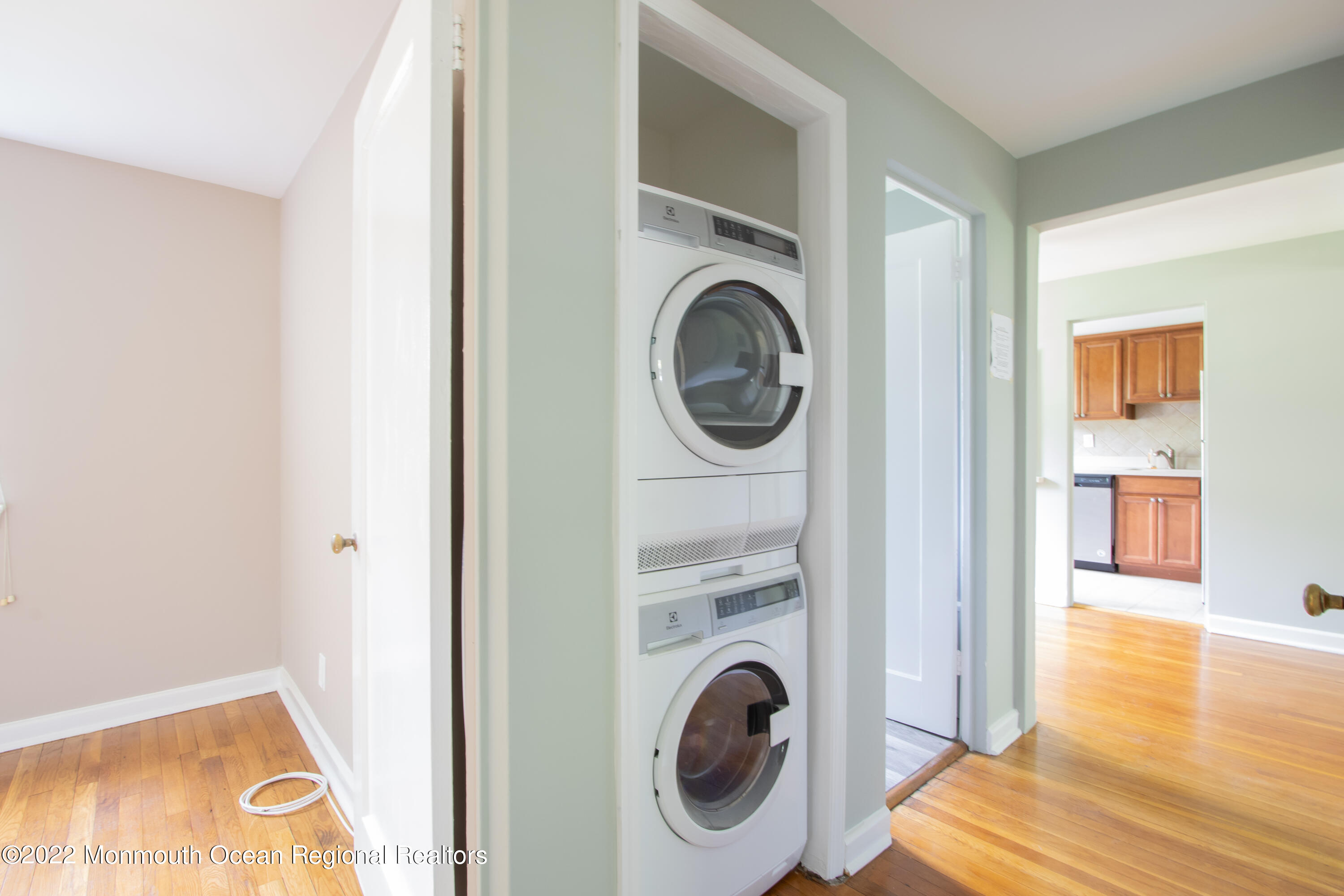 27 Manor Drive Red Bank, NJ 07701 - Photo 15 of 17 a view of a hallway with washer and dryer