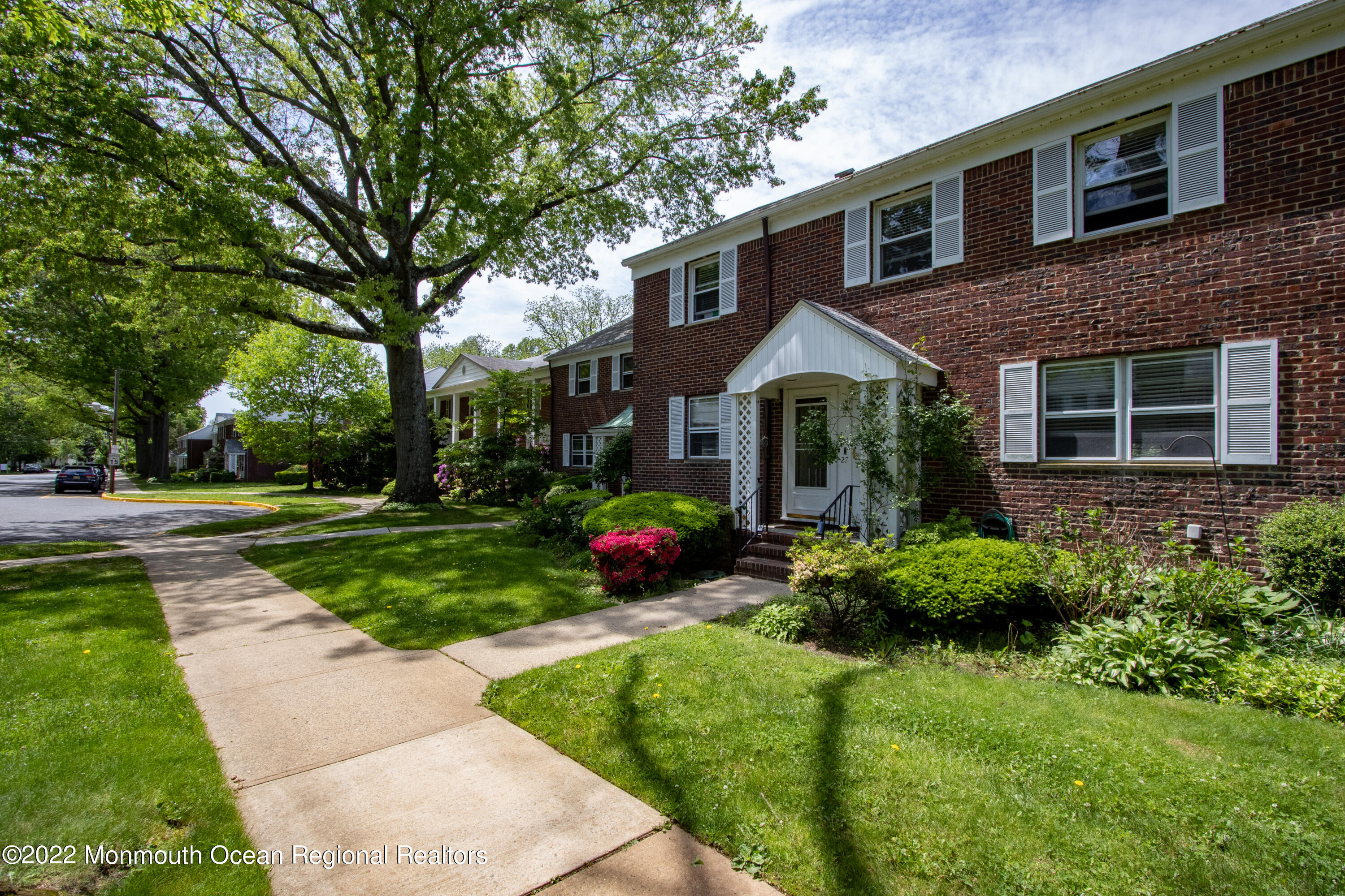 27 Manor Drive Red Bank, NJ 07701 - Photo 2 of 17 a front view of a house with yard and green space
