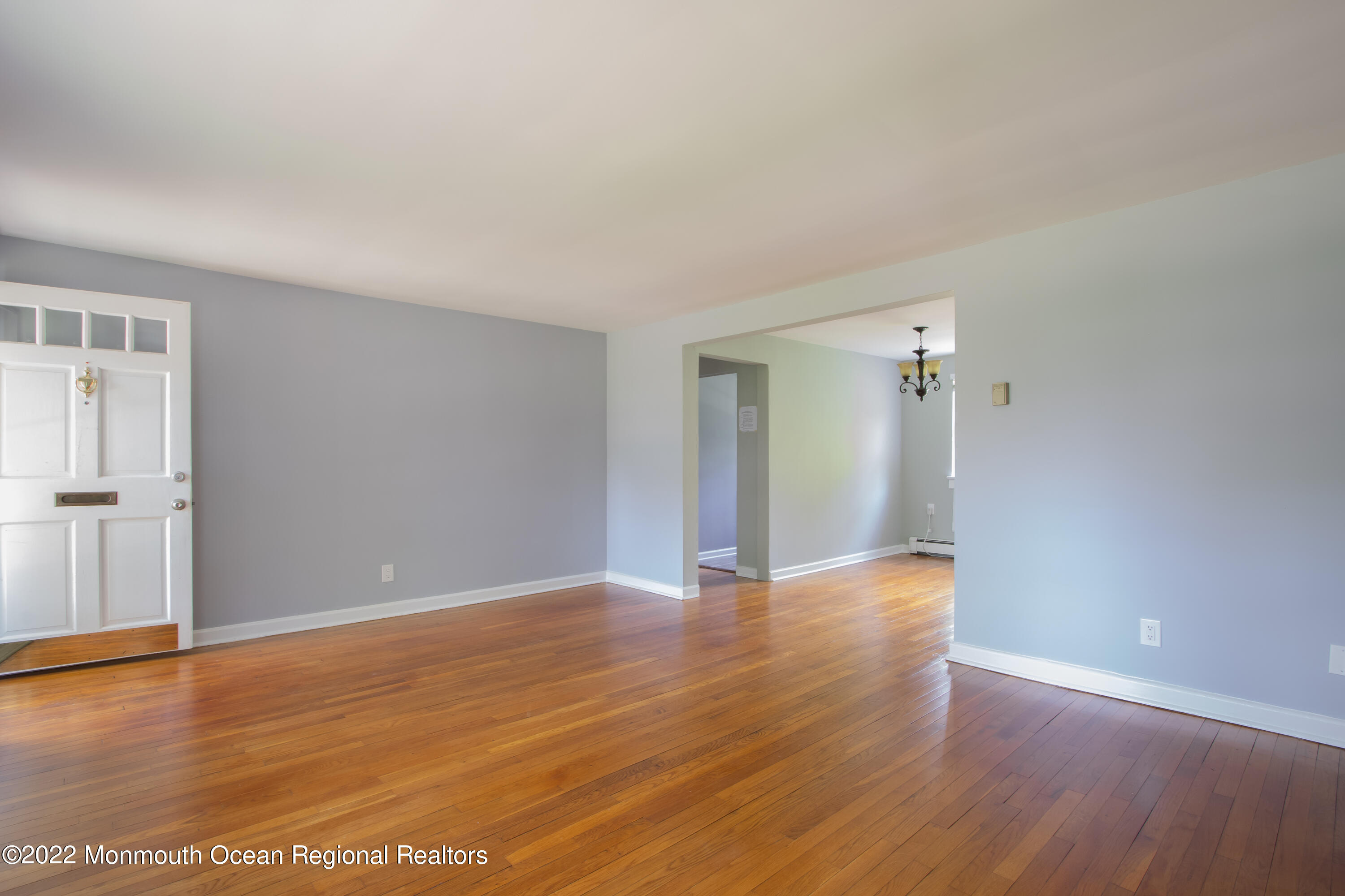27 Manor Drive Red Bank, NJ 07701 - Photo 6 of 17 a view of an empty room with wooden floor