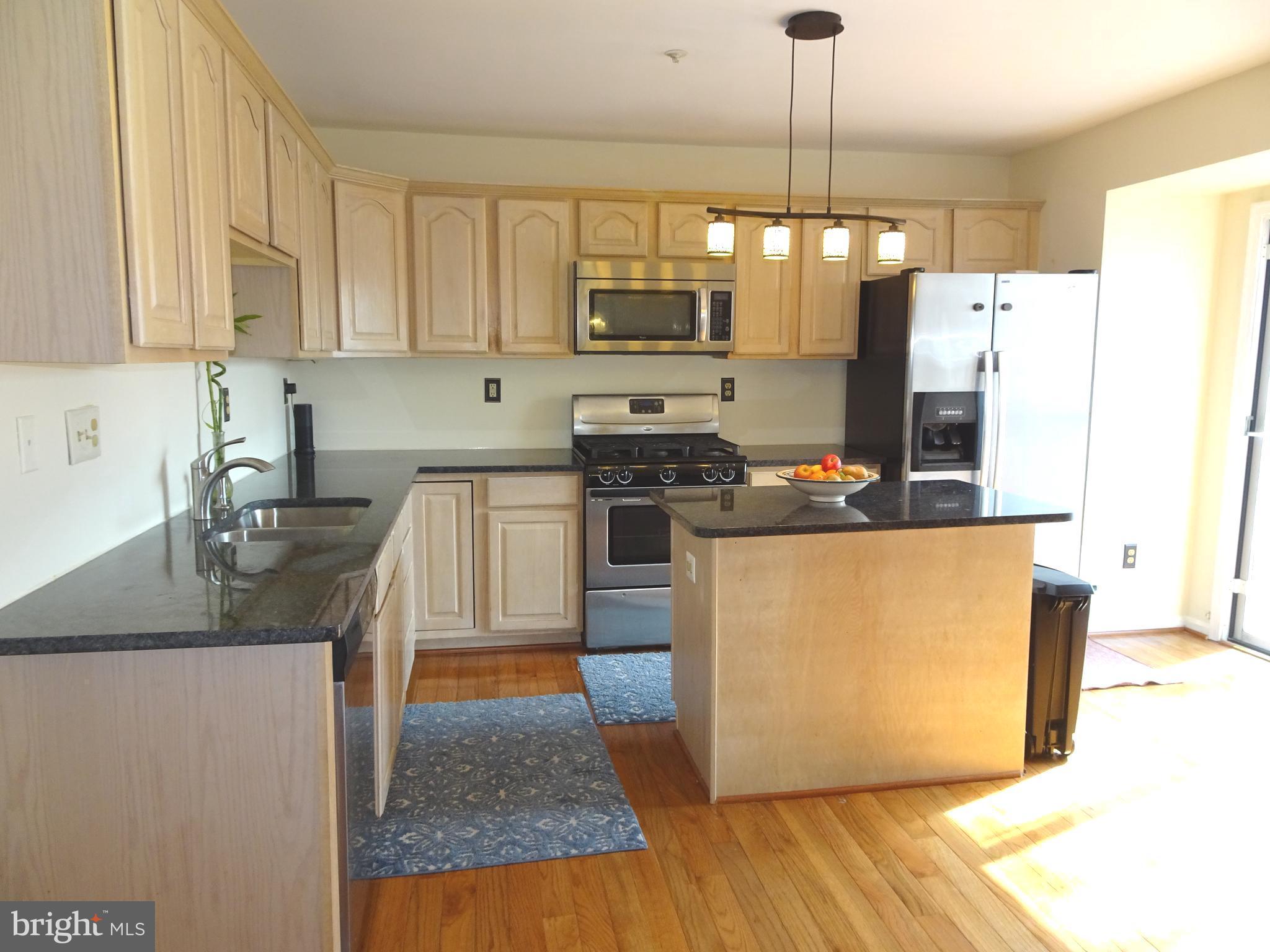 11240 Watermill Lane Silver Spring, MD 20902 - Photo 5 of 19 Kitchen with Granite Counters and Island