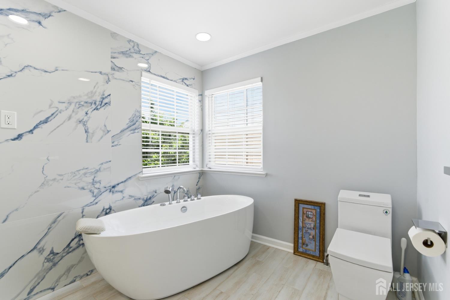 26 Alexis Lane Edison, NJ 08820 - Photo 22 of 39 a white bath tub sitting next to a white toilet