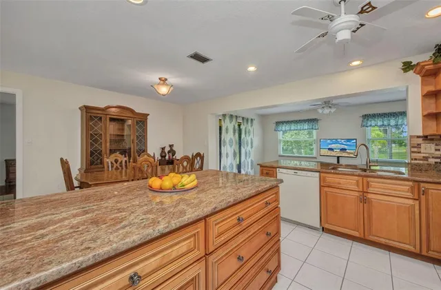 a kitchen with sink and window