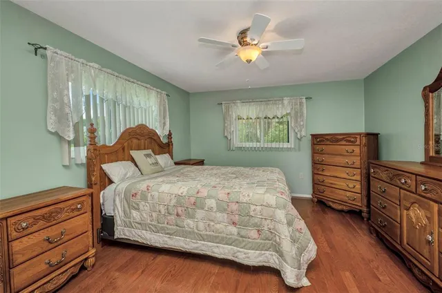 a bedroom with a bed and a dresser