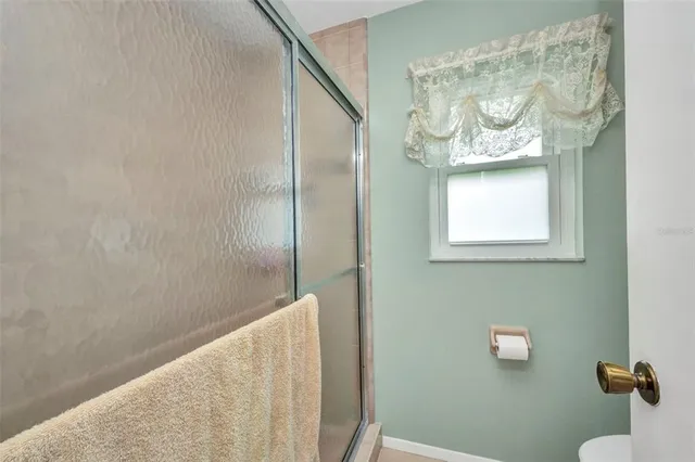 a bathroom with a bathtub and shower